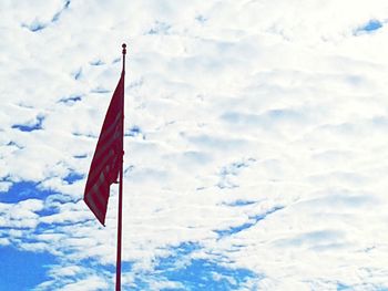 Low angle view of flag against sky