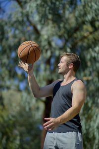 Man playing with ball at park