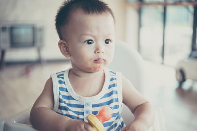 Portrait of cute boy eating food