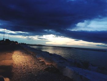 Scenic view of sea against dramatic sky