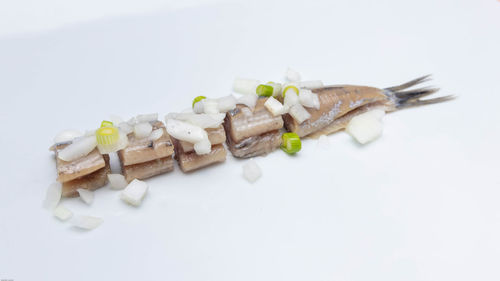 High angle view of chocolate cake on white background