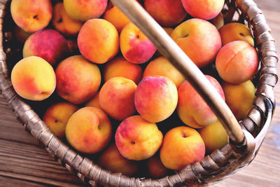 High angle view of apples in basket on table