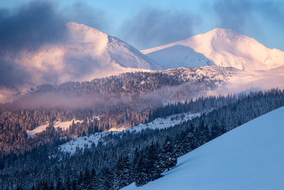 Scenic view of snowcapped mountains against sky