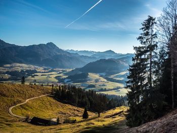 Scenic view of landscape and mountains against sky