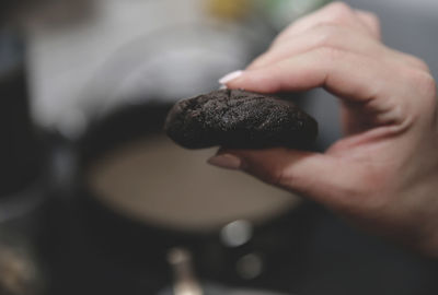 Close-up of hand holding ice cream