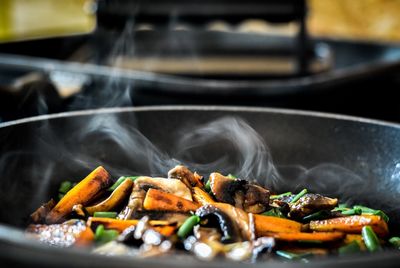 Vegetables cooking in saucepan at kitchen