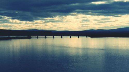 Scenic view of sea against cloudy sky