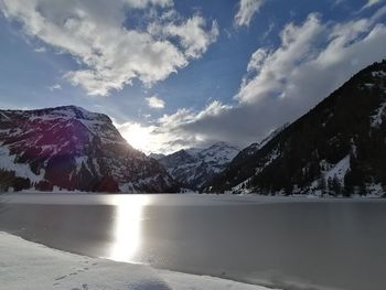 Scenic view of snowcapped mountains against sky