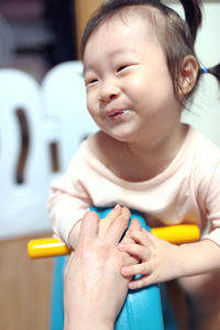 Close-up of cute girl at home