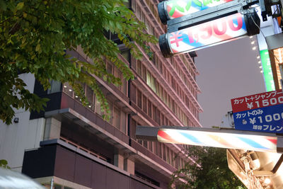 Low angle view of road sign in city