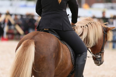 Rear view of women riding