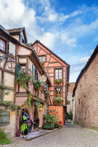 Street with historical houses in riquewihr, alsace, france