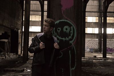 Full length of man standing in abandoned building