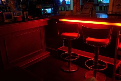 Empty chairs and table in restaurant