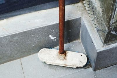 High angle view of chain on footpath