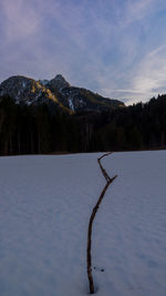 Scenic view of lake against sky during winter