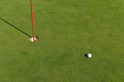 High angle view of ball on field at golf course