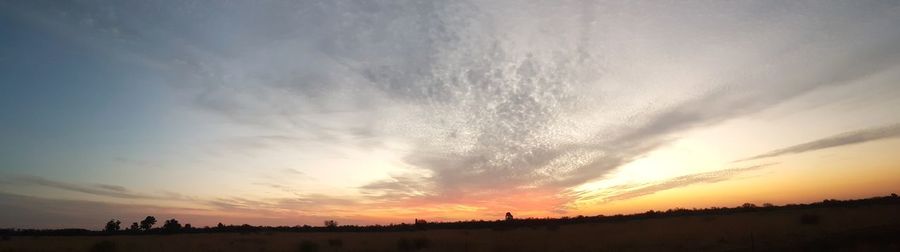 Silhouette landscape against sky during sunset