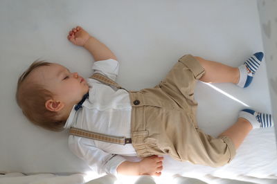 Portrait of cute little baby sleeping in his crib