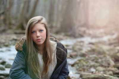 Portrait of girl sitting in forest