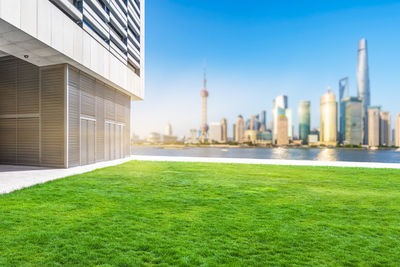 Modern buildings in city against clear sky