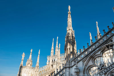 Low angle view of temple building against blue sky