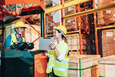 Rear view of people working at shopping mall