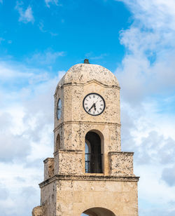 Low angle view of clock tower against sky