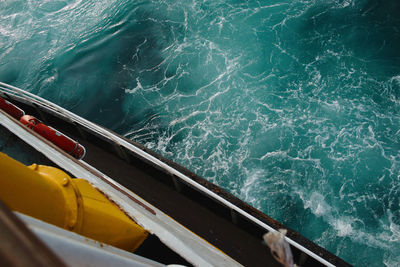 High angle view of boat sailing in sea