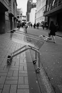 People walking on footpath in city