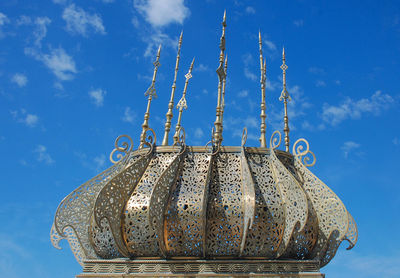 Low angle view of temple against blue sky