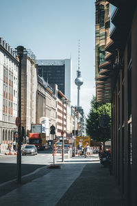 City street and buildings against sky