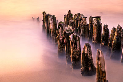 Panoramic view of rocks against sky during sunset