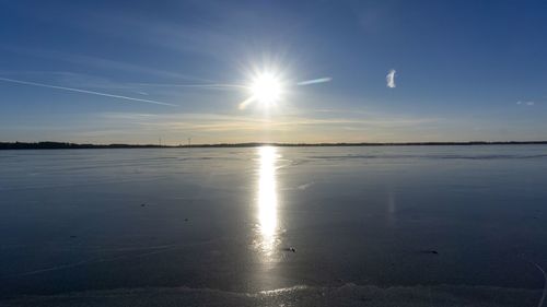 Scenic view of sea against sky at sunset