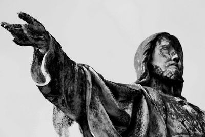 Low angle view of statue against sky