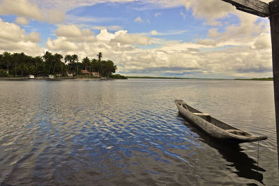 View of calm blue sea against clouds