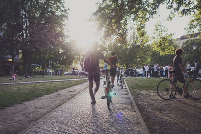 Full length of woman standing on tree trunk