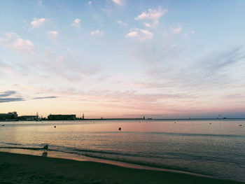 View of beach against cloudy sky