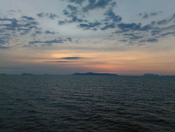 Scenic view of sea against sky at sunset