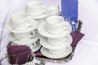 High angle view of coffee cups on table