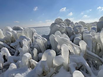 Scenic view of sea during winter against sky