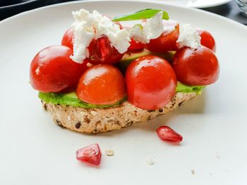 High angle view of strawberries in plate on table