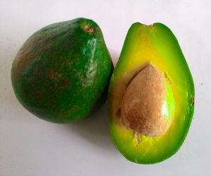 Close-up of fruit over white background