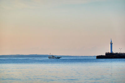 Scenic view of sea against clear sky during sunrise