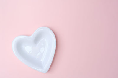 Close-up of heart shape over white background