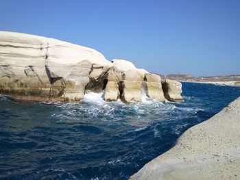 Scenic view of sea against clear blue sky