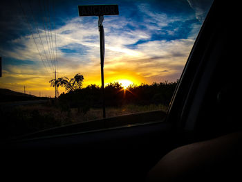 Sunset seen through car windshield