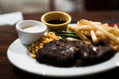 Close-up of meal served on table, steak, beef