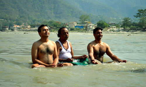 Friends playing in water