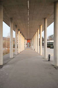 Empty road with bridge in background